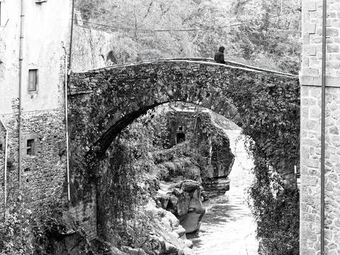 Bridge over a river at the old town of Bagnone at the Tuscany Region in Italy Stock Photos