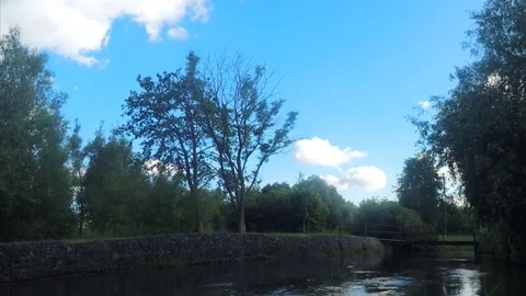 Bridge Over River In Park on sunny day Timelapse Stock Footage 78017953