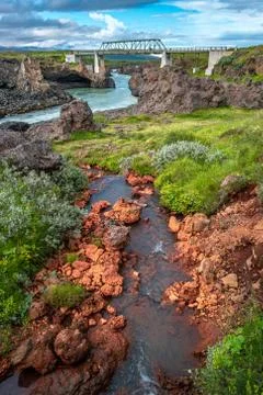 Bridge over a river with powerful waterfall Godafoss in Iceland, summer Stock Photos