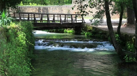 Bridge over a river stream Stock Footage 492687