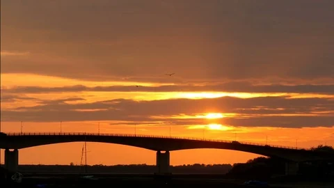 Bridge over river at sunset Stock Footage 75639240