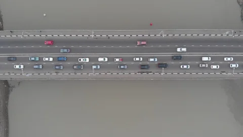 Bridge over the river with traffic in cloudy weather Stock Footage 116382485