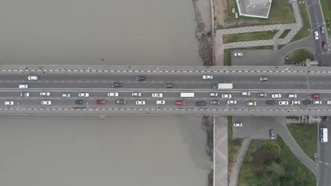 Bridge over the river with traffic jam in cloudy weather at day time Stock Footage 116382577