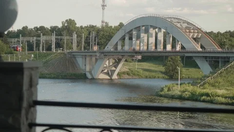 Bridge over river. Two trains are moving towards one another. 스톡 동영상 120255690