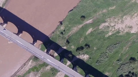 Bridge over river (vertical drone shot)  - Lesotho - 2.7K Stock Footage 90525958