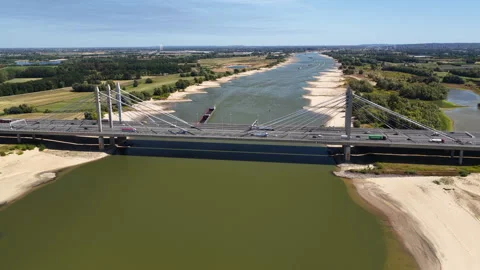 Bridge over the river Waal during summer drought seen from above Stock Footage 344394368