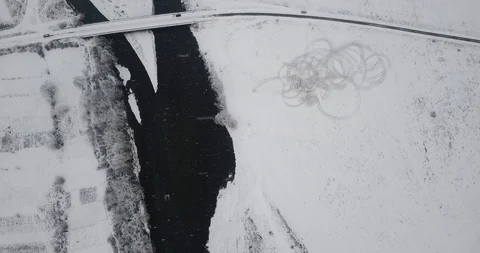 Bridge over the river winter snowfall drone Stock Footage 122601472