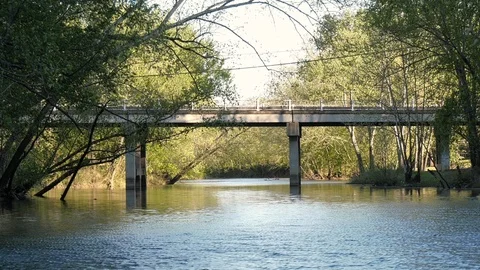 Bridge over a small river Stock Footage 107154483