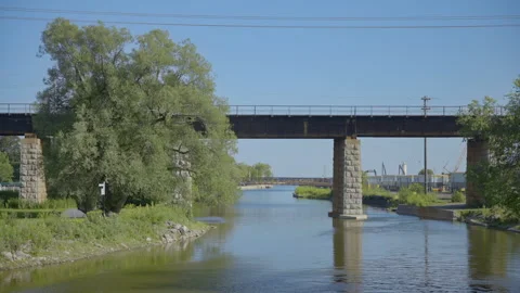 Bridge over small river Stock Footage 211879016