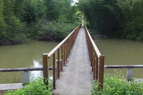 The bridge over a small river in a northeastern urban park, with a concrete.. Stock Photos