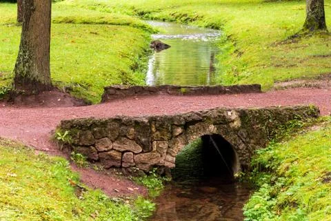 Bridge over a small stream in the lower park of Peterhof, Petrodvorets, St. P Stock Photos