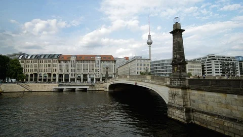 Bridge over Spree river from cathedral building, and Berlin TV tower back side Stock Footage 127154472