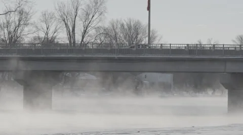 Bridge over steaming river Stock Footage 33893067