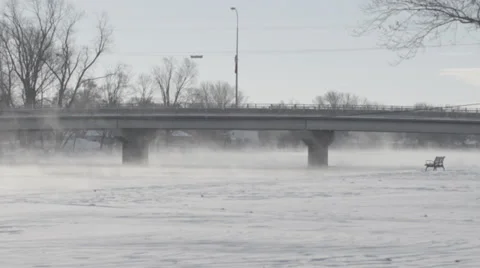 Bridge over steaming river Stock Footage 33895250