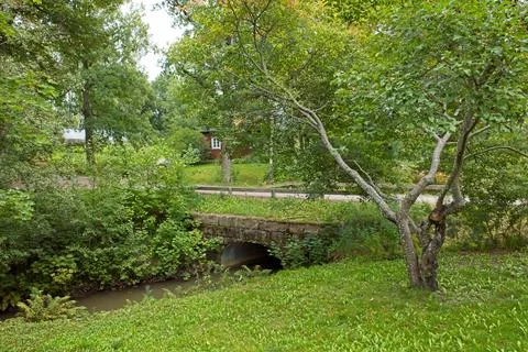 Bridge over stream. Stock Photos