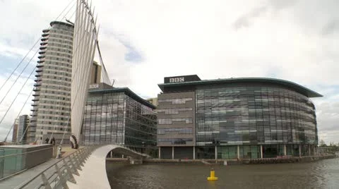 Bridge over water to business complex Stock Footage 12459442