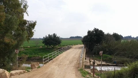 Bridge over water in fields Stock Footage 125908844