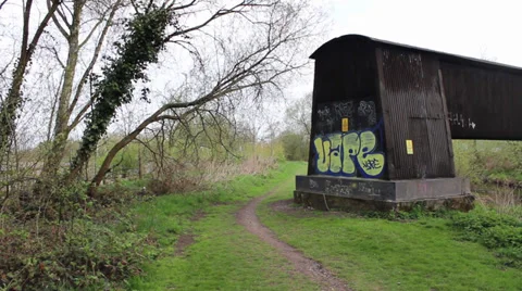 Bridge over water with Graffiti Stock Footage 34605683