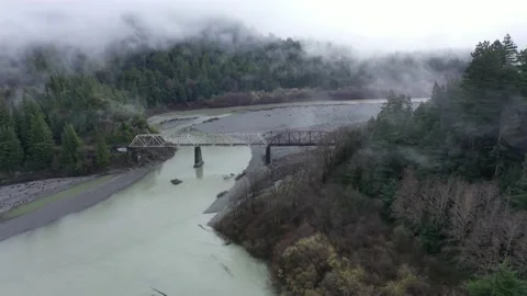 Bridge over water with trees and fog 스톡 동영상 149644003