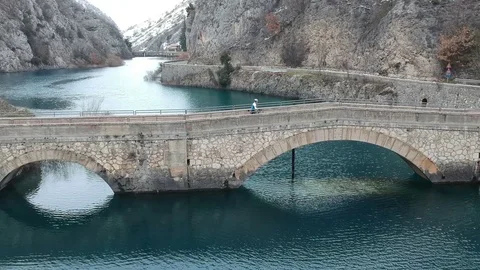 A bridge over a winter river Stock Footage 114748998