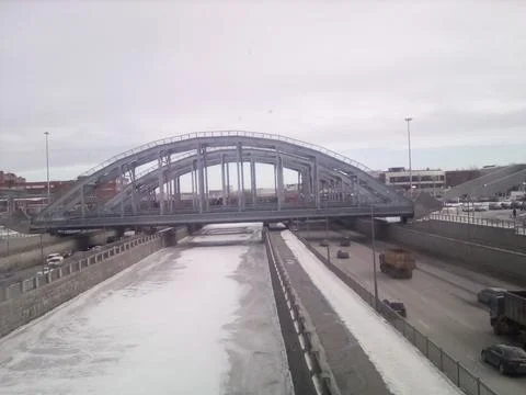 Bridge over the winter river Stock Photos