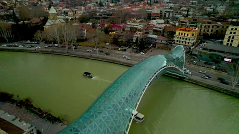 The Bridge of Peace over the Mtkvari River in Tbilisi, Georgia. Stock Footage 332920089