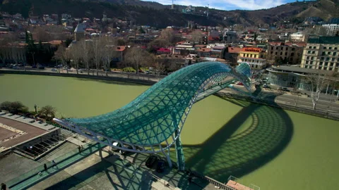 The Bridge of Peace over the Mtkvari River in Tbilisi, Georgia. Stock Footage 332920364