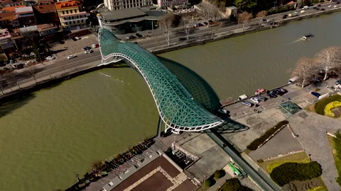 The Bridge of Peace over the Mtkvari River in Tbilisi, Georgia. Stock Footage 332920534