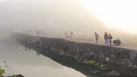 BRIDGE WITH PEOPLE BETWEEN THE FOG Stock Footage 94230223