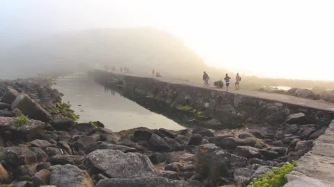BRIDGE WITH PEOPLE BETWEEN THE FOG Stock Footage 94231767