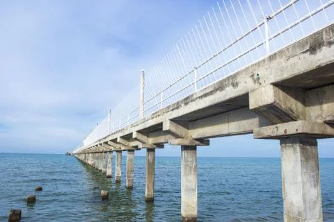 Bridge pier extending into the sea Stock Photos