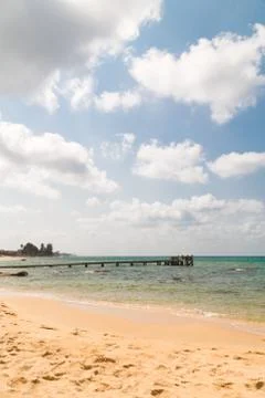 Bridge pier on the sandy beach Stock Photos
