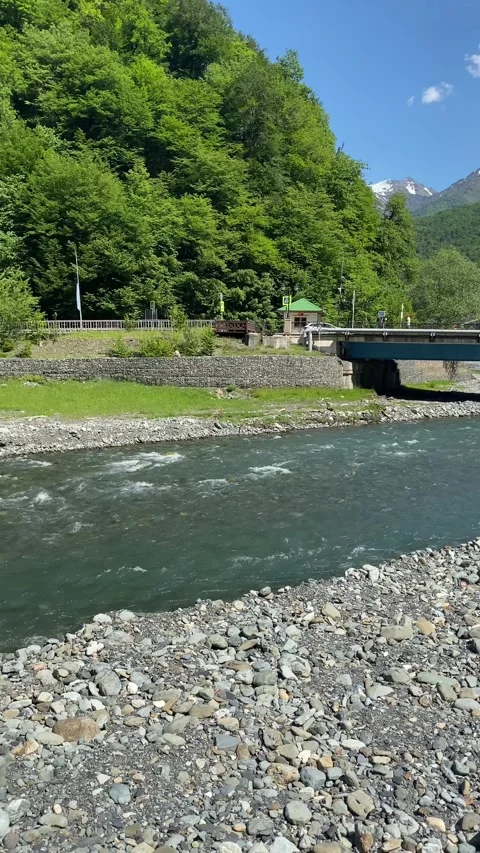 Bridge provides perfect vantage point to admire clear river Stock Footage 278714353