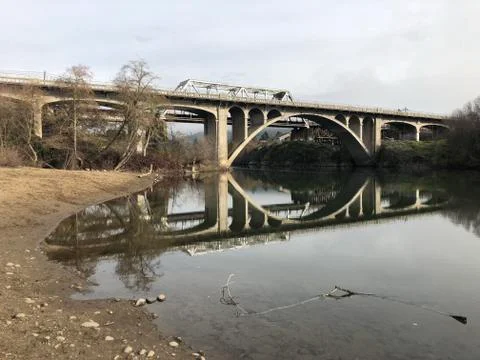 Bridge reflecting in the river Stock Photos
