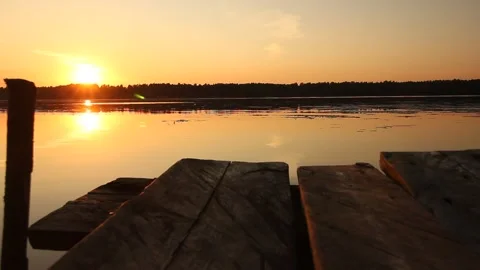 Bridge on the river against the background of an evening sunset. Stock Footage 155243461