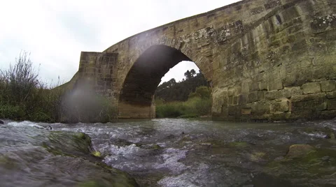 Bridge. River. Cyclist. Video stock 64915874