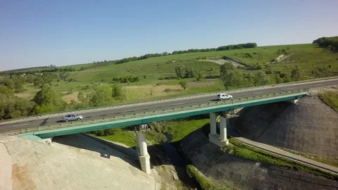 Bridge, road junction, freight transport on the road, summer day, aerial Stock Footage 89656961