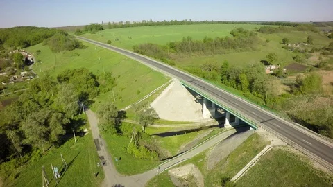 Bridge, road junction, freight transport on the road, summer day, aerial Stock Footage 89657102