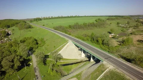 Bridge, road junction, freight transport on the road, summer day, aerial Video stock 89657164