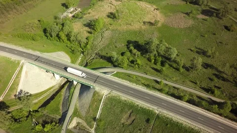 Bridge, road junction, freight transport on the road, summer day, aerial 스톡 동영상 89657239