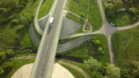 Bridge, road junction, freight transport on the road, summer day, aerial Stock Footage 89899427