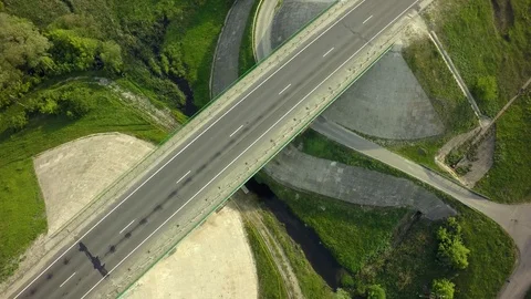 Bridge, road junction, freight transport on the road, summer day, aerial Stock Footage 89899499