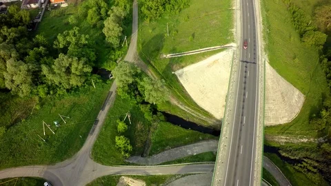 Bridge, road junction, freight transport on the road, summer day, aerial Stock Footage 89899668