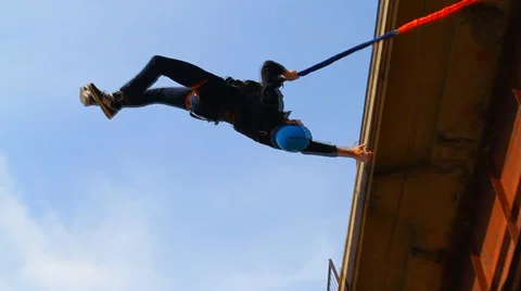 Bridge side man flips back Stock Footage 37033608