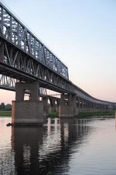Bridge silhouette on background of sunset. Cityscape with sunset. Stock Photos