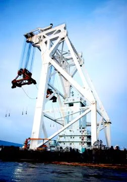 Bridge span heavy construction crane Stock Photos