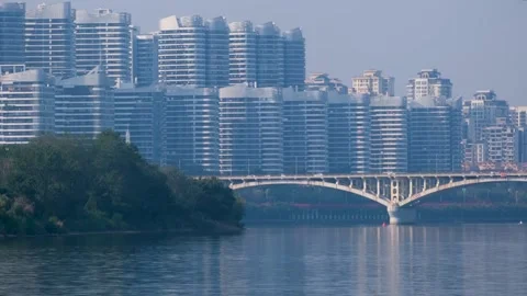 A bridge spanning across the Liujiang River and apartment buildings in Liuzhou Stock Footage 295253387