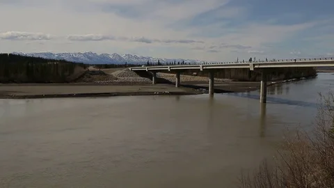 Bridge spanning large River in Alaska Stock Footage 79322227