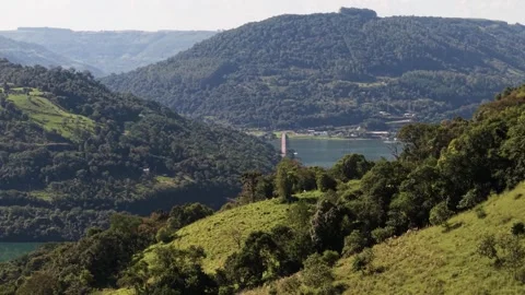 A bridge spanning a river between mountains. Goio-Ên. Uruguai river. Video stock 331826996