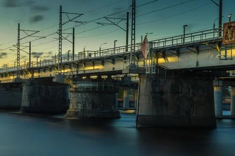 Bridge spanning a river or canal at twilight. Stock Photos